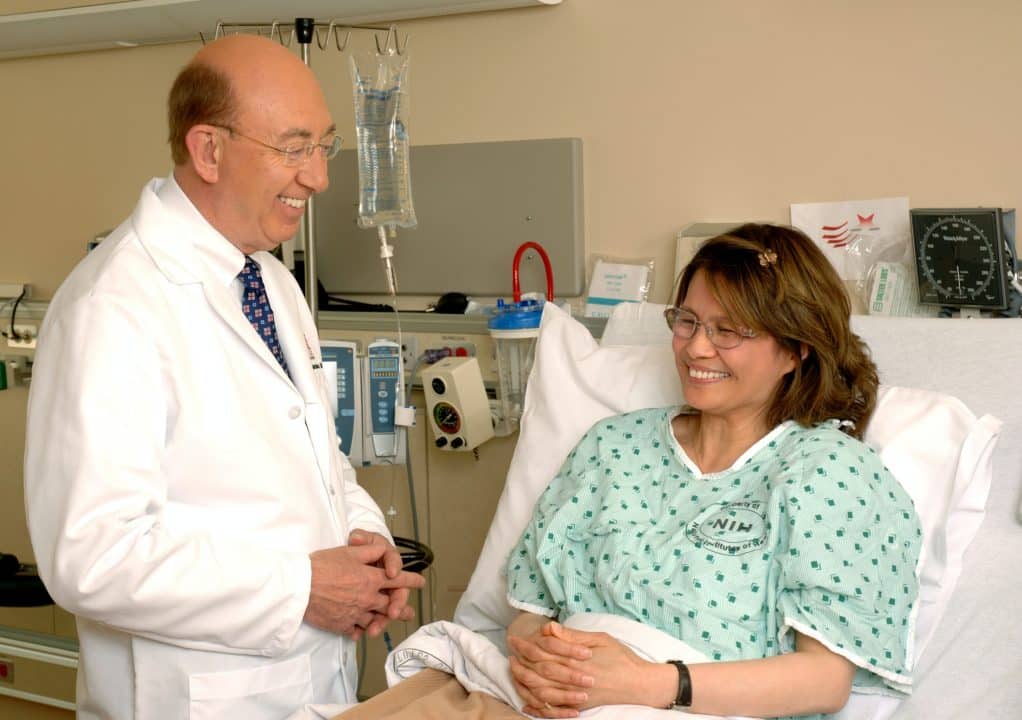 A doctor talking to a female patient.
