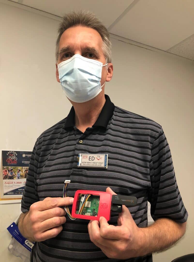 Ed Goles, Maintenance Supervisor, with his customized name tag and Raspberry Pi computer.